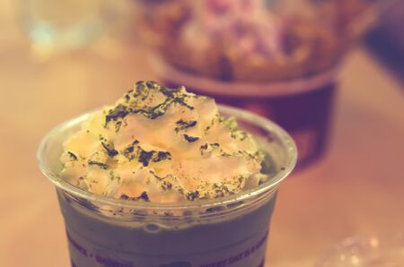 Whipped cream, green tea.Film style color effectの写真素材