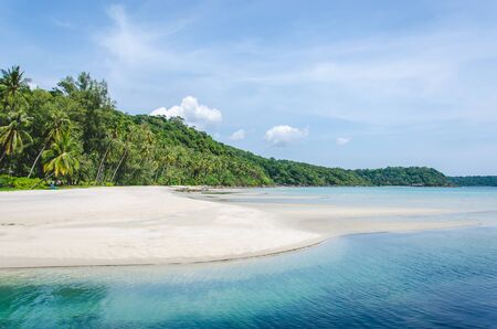 Tropical beach with sea wave on the sand and palm trees.Island Koodの写真素材
