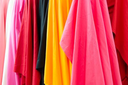 Closeup of various fabric bolts in storeの写真素材