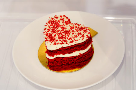 Heart shaped cake on dish.