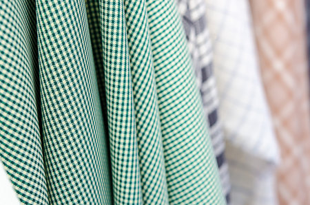 Closeup of various fabric bolts in store