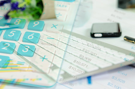 Calculator and keyboard ,documents on office tableの写真素材