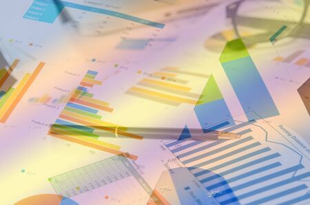 Financial paper charts and graphs on the tableの写真素材