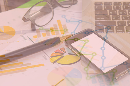 Financial papers, computer and office supplies closeupの写真素材