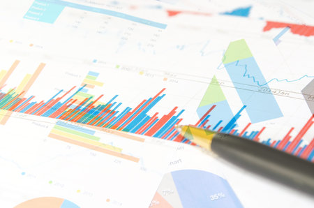 Financial paper charts and graphs on the table.business conceptの写真素材