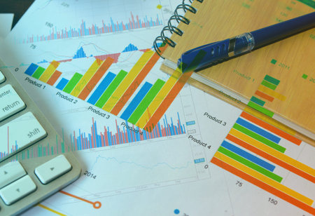 closeup graph  with keyboard on office table, financial and business concept