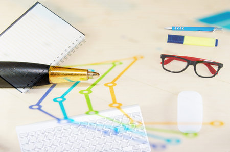 Financial graphs analysis and pen.business concept