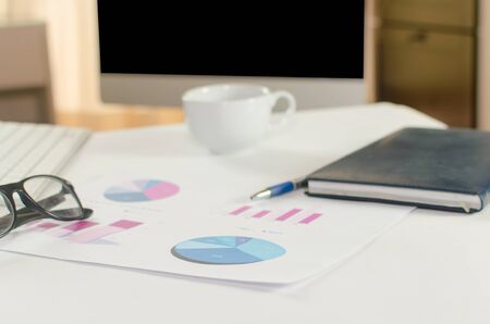 Financial paper charts and graphs on the tableの写真素材