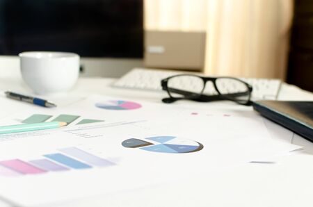 Financial paper charts and graphs on the tableの写真素材