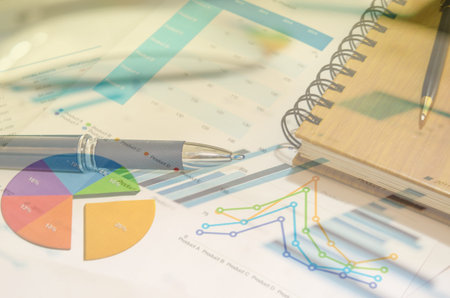 Workplace with keyboard and graphs.business Conceptの写真素材