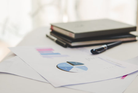 business documents with charts growth, keyboard and pen. workplace businessman