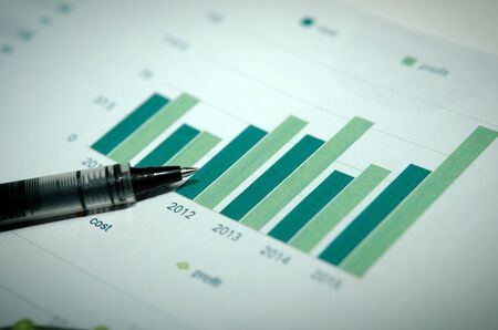 Financial graphs analysis and pen.の写真素材