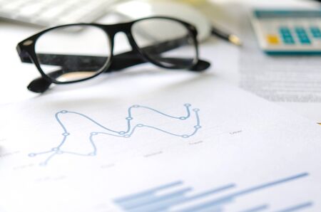 Financial paper charts and graphs on the tableの写真素材