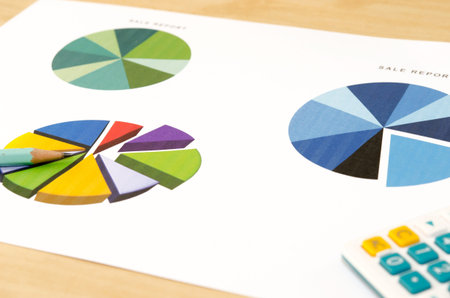 Financial paper charts and graphs on the table