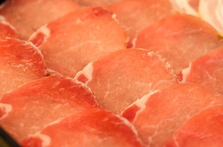 freshness slided pork on white dish for grill or boilの写真素材