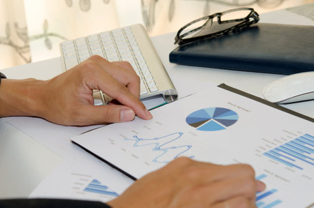 Business of financial analytics desktop with accounting charts and diagramsの写真素材