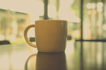 Coffee cup in coffee shop - vintage styleの写真素材