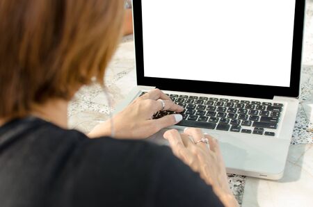 businesswoman analyzing graphs on laptopの写真素材