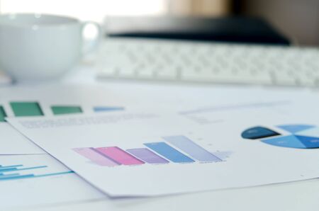 Graphs and chart on the deskの写真素材