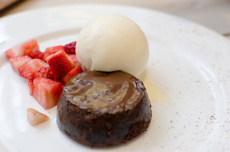 toasted bread and chocolate ice cream with strawberriesの写真素材