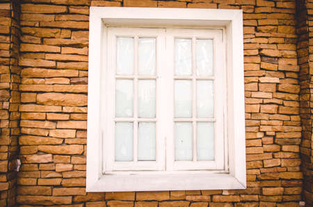 Window on brick wall with vintage toneの写真素材