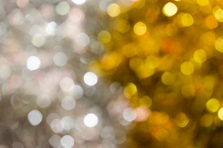 yellow and silver  holiday bokeh. Abstract Christmas backgroundの写真素材