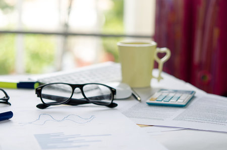 Business of financial analytics desktop with accounting charts and diagrams