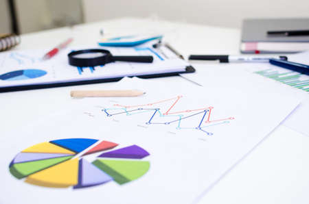 Graphic and business papers Pen and notebook on a desk.の写真素材