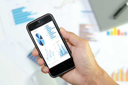 graphs and charts being demonstrated on the screen of a phone