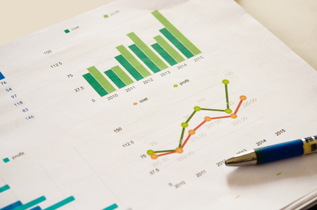 Financial graphs analysis and pen.の写真素材