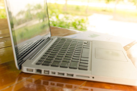 workspace with modern laptop at sunrise