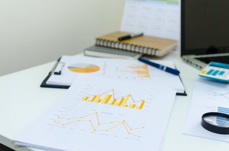 Office desk with supplies calculator pen notepadの写真素材