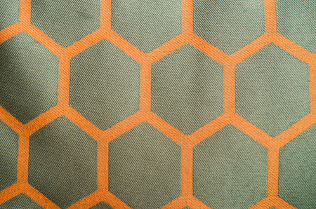 Hexagon orange patterned fabric as a background