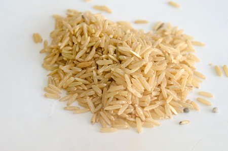 brown rice on the white background.の写真素材