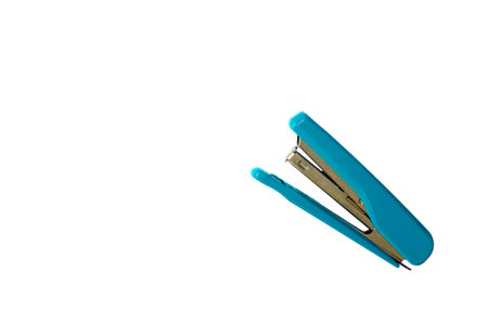 green stapler isolated on white background.copy space