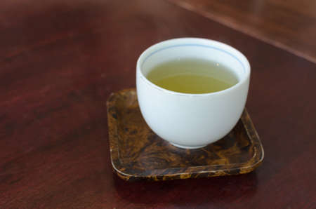 Green tea in a white cup onの写真素材