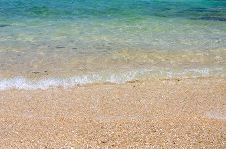 Wave of the sea on the sand beach