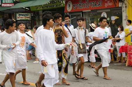 PHUKET , THAILAND - OCT 6, 2016: Unidentified  Taoist devotee joins a procession of the Phuket Vegetarian Festival. The event is famous for its spirit mediums who undergo ritual mutilation and piercing.のeditorial素材