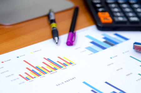 Financial graphs analysis and pen.の写真素材