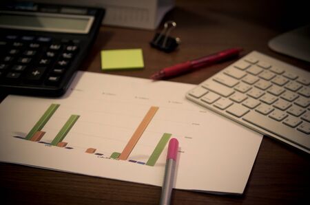 business documents on office table, financial with social network diagram and digital information.の写真素材