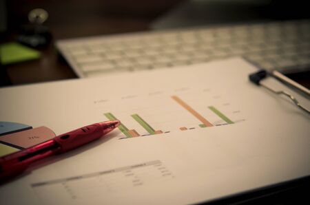 business charts or graphs with keyboard - filter vintage.の写真素材