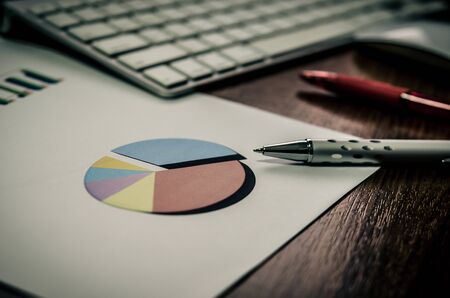 business document in office workplace with computerの写真素材