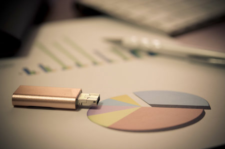 Financial paper charts and graphs on the table.Filter vintage