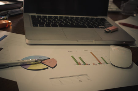 documents on office table with laptop computer and graph financial with social network diagram - Filter vintageの写真素材
