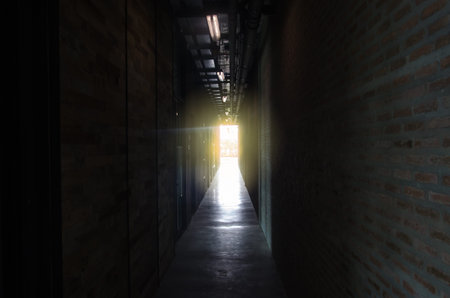 The light from the window of an old hotel corridor.