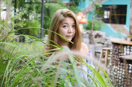 A portrait of a beautiful asian woman outdoor.
