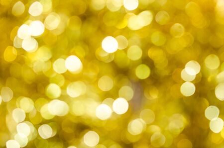 abstract background gold bokeh lights defocused.の写真素材