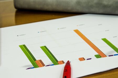 Business documents, analysis and graph on desk.の写真素材