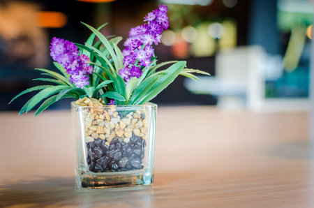 Vintage purple flowers on the table in a restaurant.の写真素材