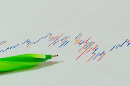 Financial graphs analysis and pen.の写真素材